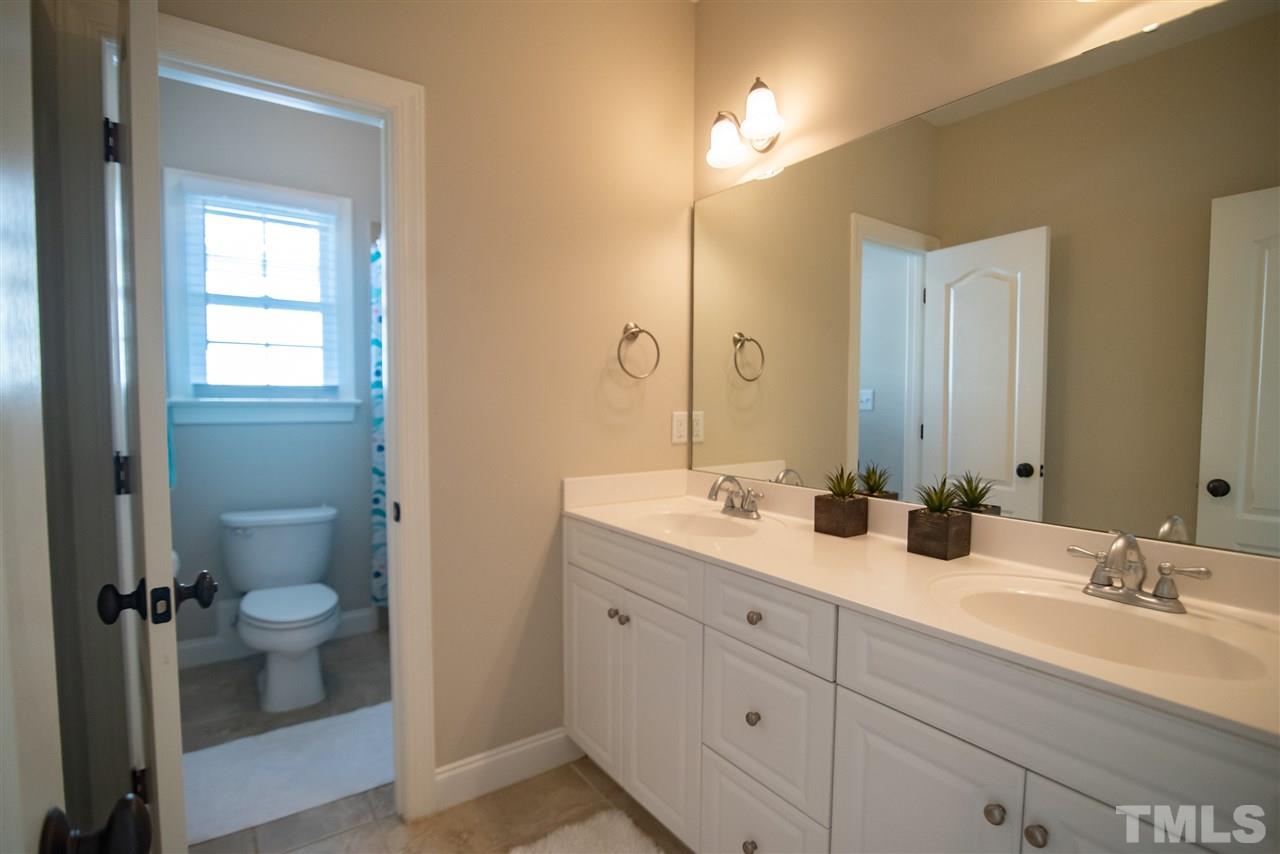 2203 Hopeton Avenue Raleigh, NC 27614 - Photo 19 of 25 Double vanity sink and separate shower area.