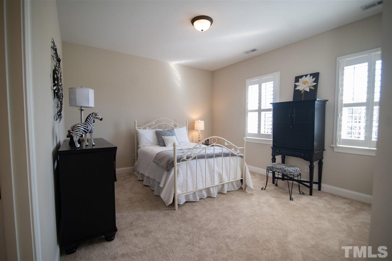 2203 Hopeton Avenue Raleigh, NC 27614 - Photo 20 of 25 This dreamy bedroom is refreshing and comfortable.
