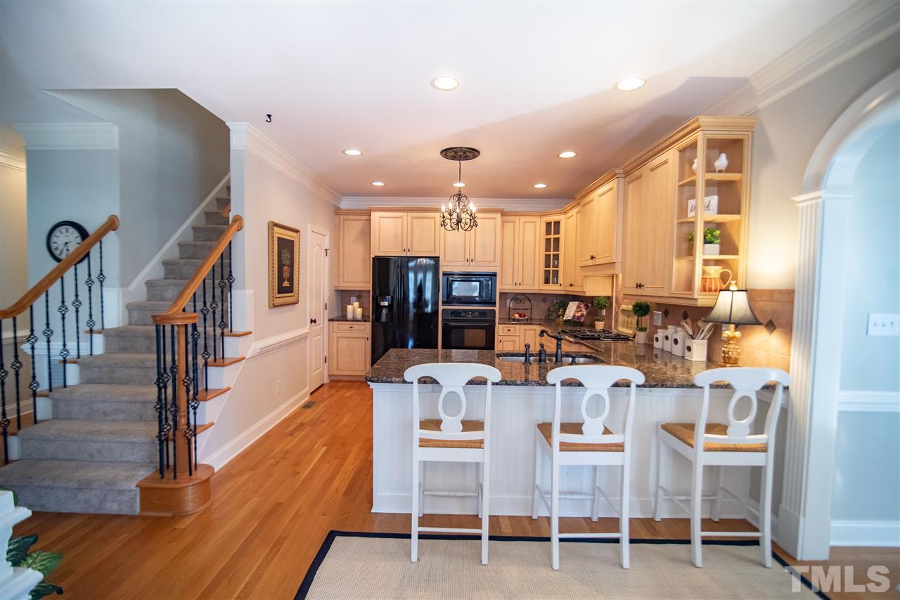 2203 Hopeton Avenue Raleigh, NC 27614 - Photo 6 of 25 This chefs kitchen will dazzle you with the granite countertops, generous cabinet space, elegant light fixture and spacious layout.