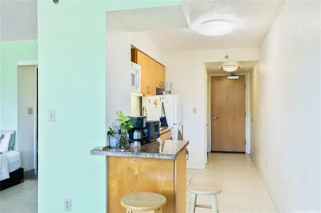 a living room with furniture and a mirror