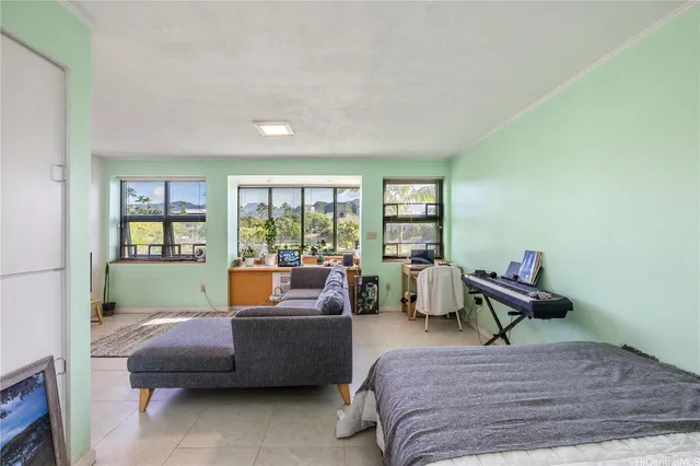 a bedroom with a bed and a couch