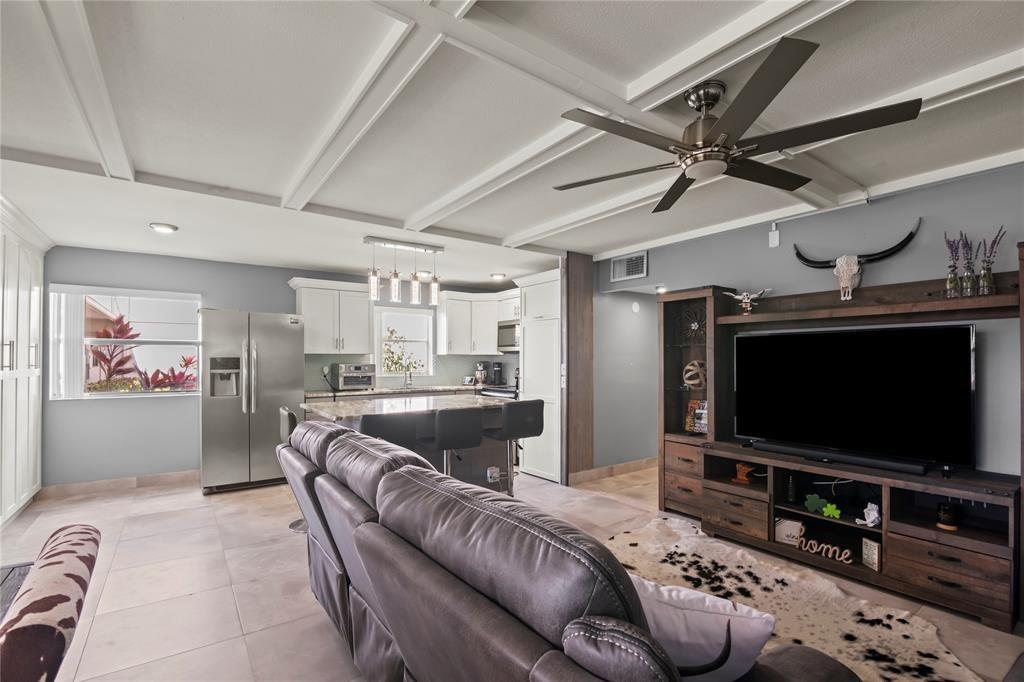 352 Saxony Trail, Unit 352 Delray Beach, FL 33446 - Photo 6 of 17 a living room with furniture and a flat screen tv