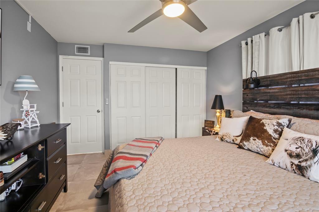 352 Saxony Trail, Unit 352 Delray Beach, FL 33446 - Photo 10 of 17 a bedroom with a bed and a night stand