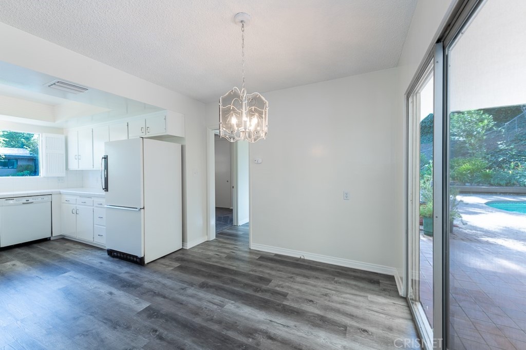 3949 Ballina Drive Encino, CA 91436 - Photo 11 of 31 a view of a kitchen with wooden floor and a large window