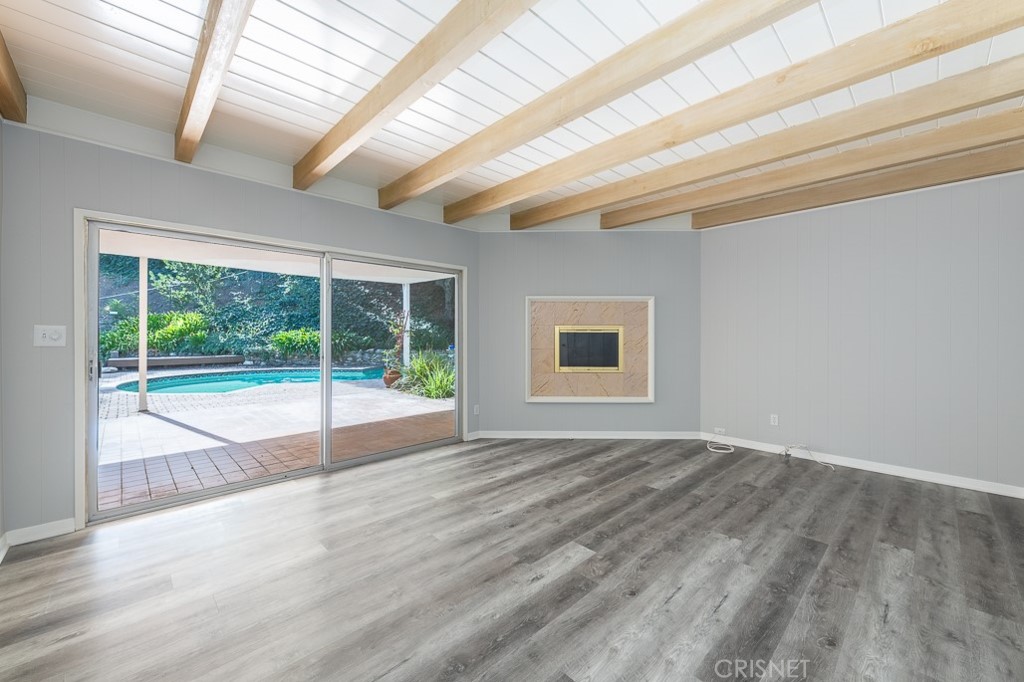 3949 Ballina Drive Encino, CA 91436 - Photo 15 of 31 a view of an empty room with wooden floor and a window