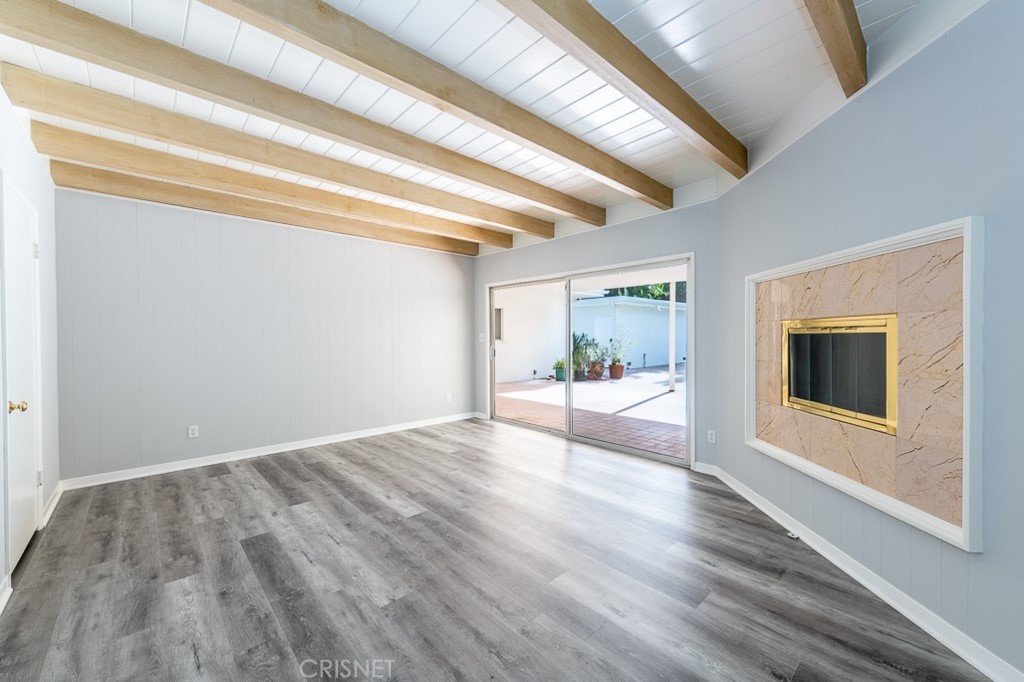 3949 Ballina Drive Encino, CA 91436 - Photo 16 of 31 a view of an empty room with wooden floor and a window