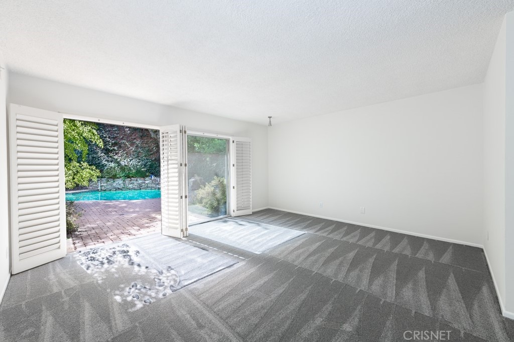 3949 Ballina Drive Encino, CA 91436 - Photo 17 of 31 a view of a room with wooden floor and large windows