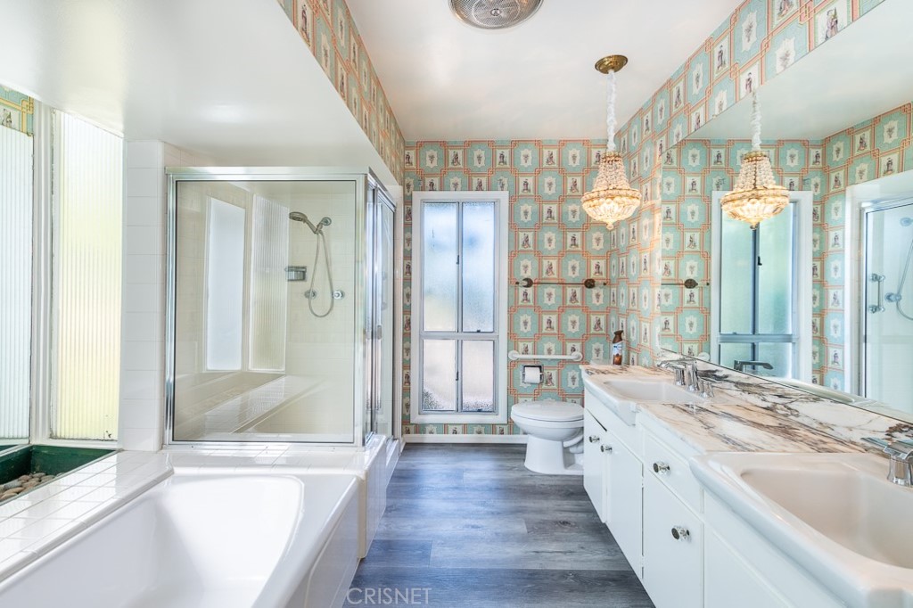 3949 Ballina Drive Encino, CA 91436 - Photo 20 of 31 a spacious bathroom with a large tub shower and sink