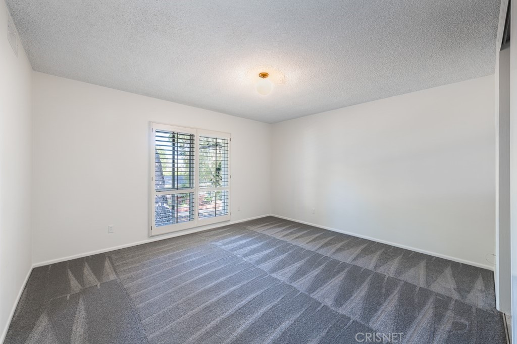 3949 Ballina Drive Encino, CA 91436 - Photo 21 of 31 a view of an empty room with wooden floor and a window