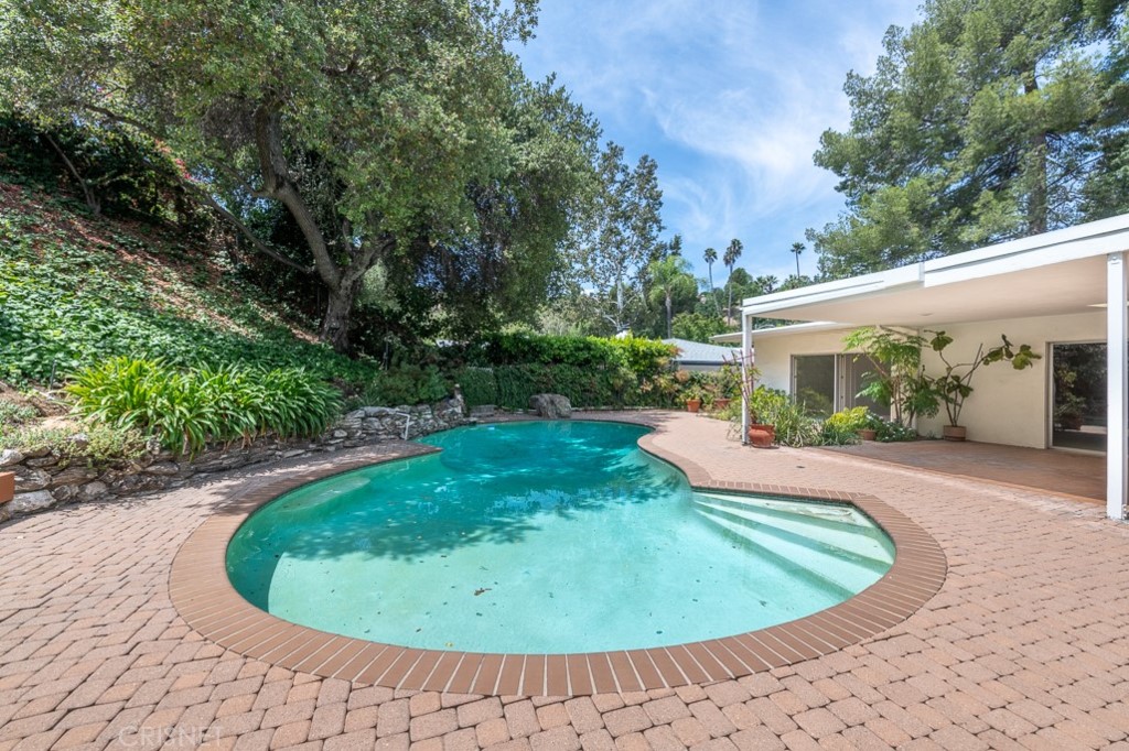 3949 Ballina Drive Encino, CA 91436 - Photo 29 of 31 a view of a swimming pool with a patio