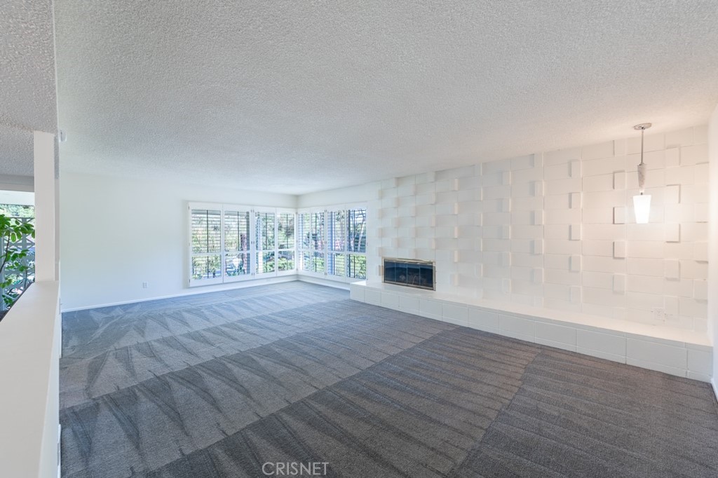 3949 Ballina Drive Encino, CA 91436 - Photo 8 of 31 a view of an empty room with wooden floor and a window