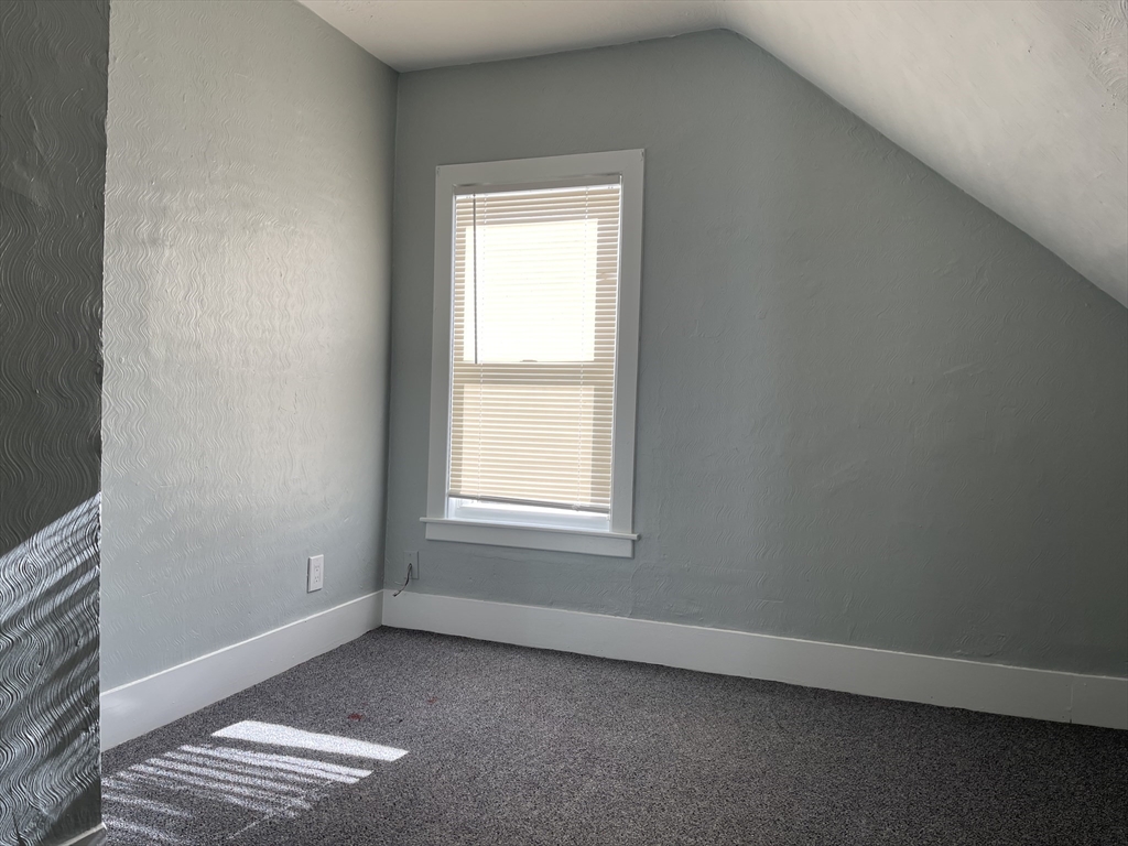 24 Union Street, Unit 3 Taunton, MA 02780 - Photo 8 of 10 an empty room with a window