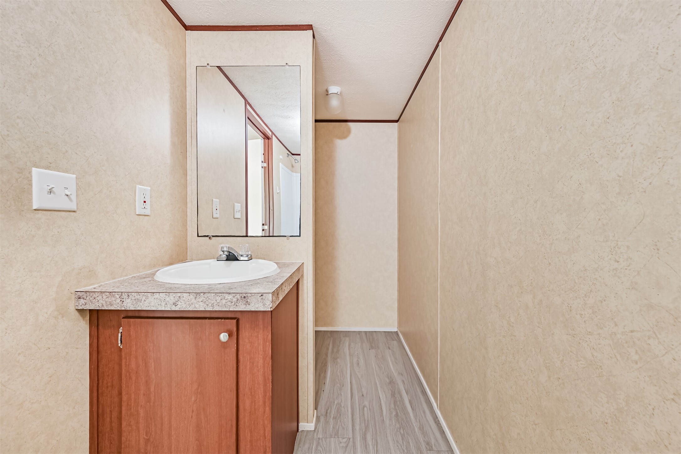 4702 10th Street Bacliff, TX 77518 - Photo 21 of 33 a bathroom with a granite countertop sink and a mirror