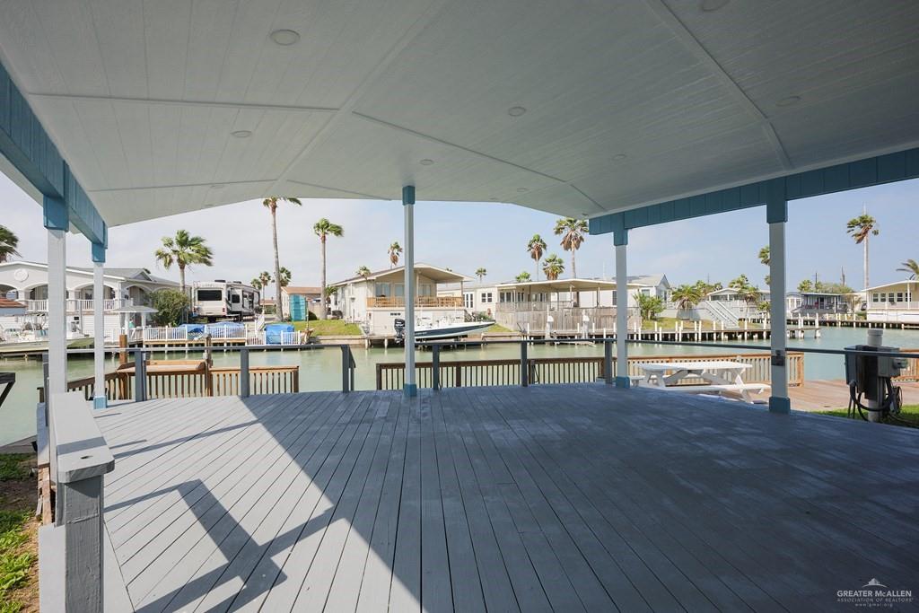 87 Abalone Circle Port Isabel, TX 78578 - Photo 18 of 40 a room with lots of wooden furniture and view kitchen