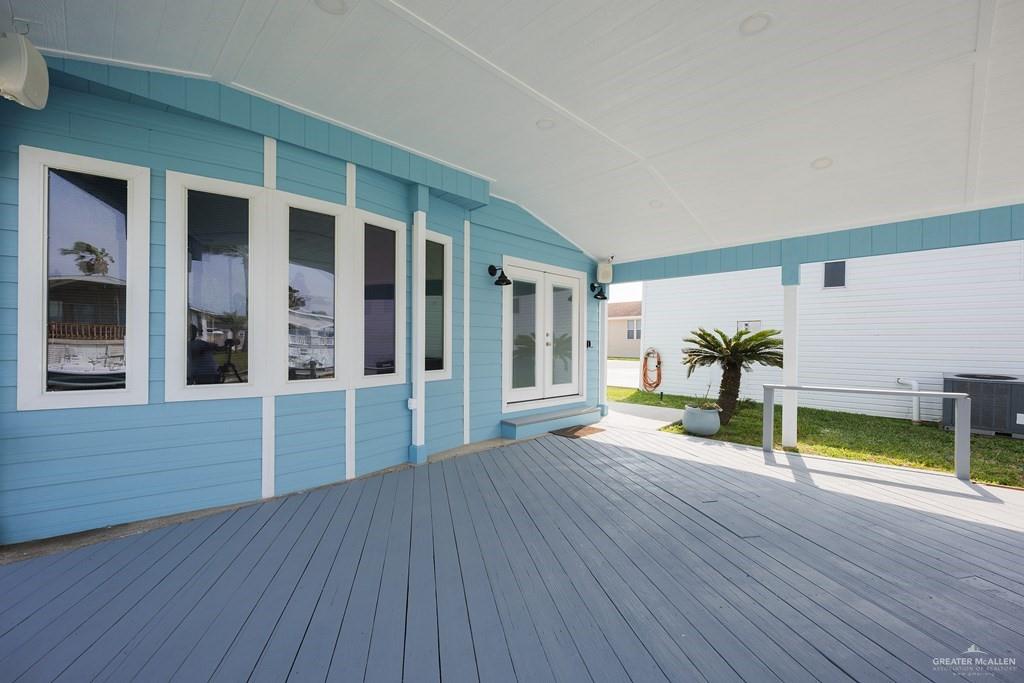 87 Abalone Circle Port Isabel, TX 78578 - Photo 19 of 40 a view of an empty room with wooden floor and a window