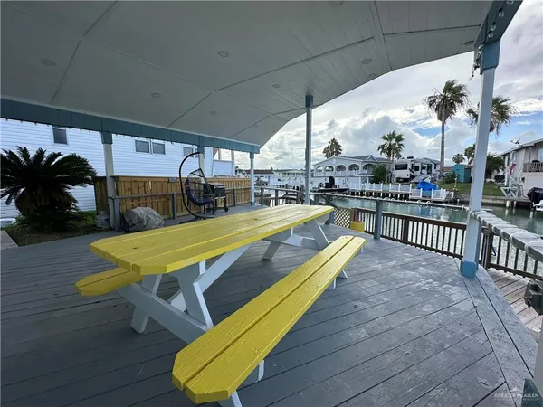 a view of a swimming pool with outdoor seating