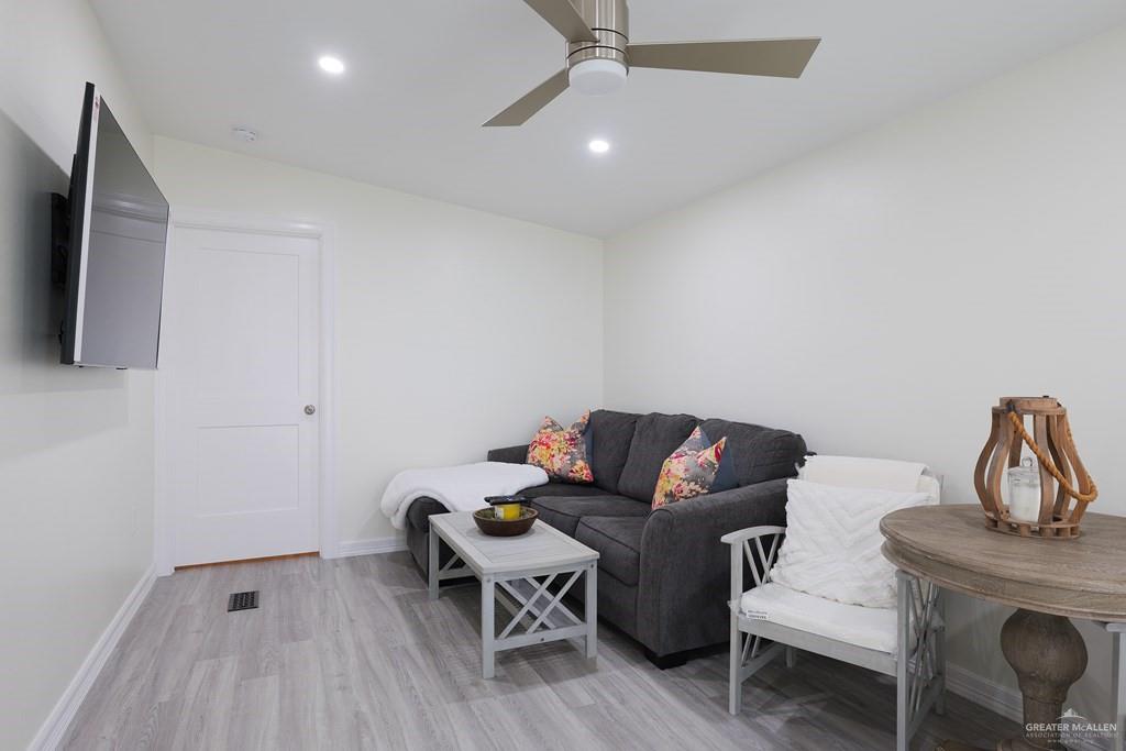 87 Abalone Circle Port Isabel, TX 78578 - Photo 3 of 40 a living room with furniture and a flat screen tv