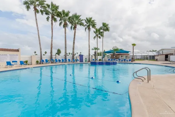a view of swimming pool with chairs
