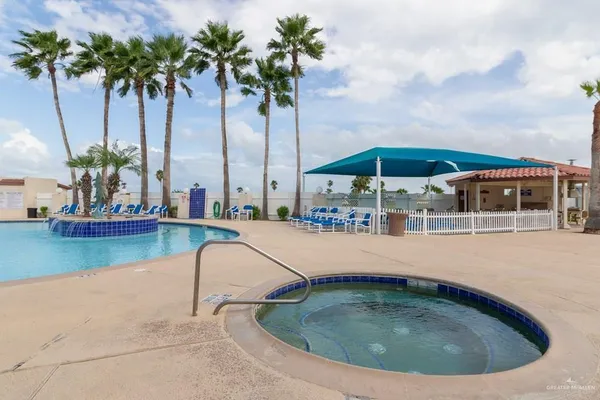 a view of swimming pool with a yard