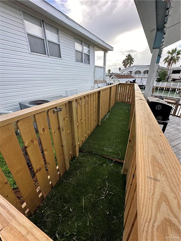 87 Abalone Circle Port Isabel, TX 78578 - Photo 40 of 40 a view of a balcony with wooden floor and fence