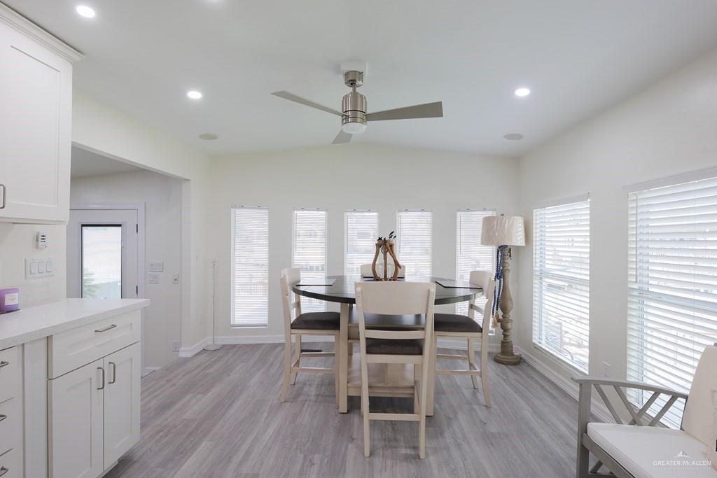 87 Abalone Circle Port Isabel, TX 78578 - Photo 7 of 40 a view of a dining room with furniture and wooden floor