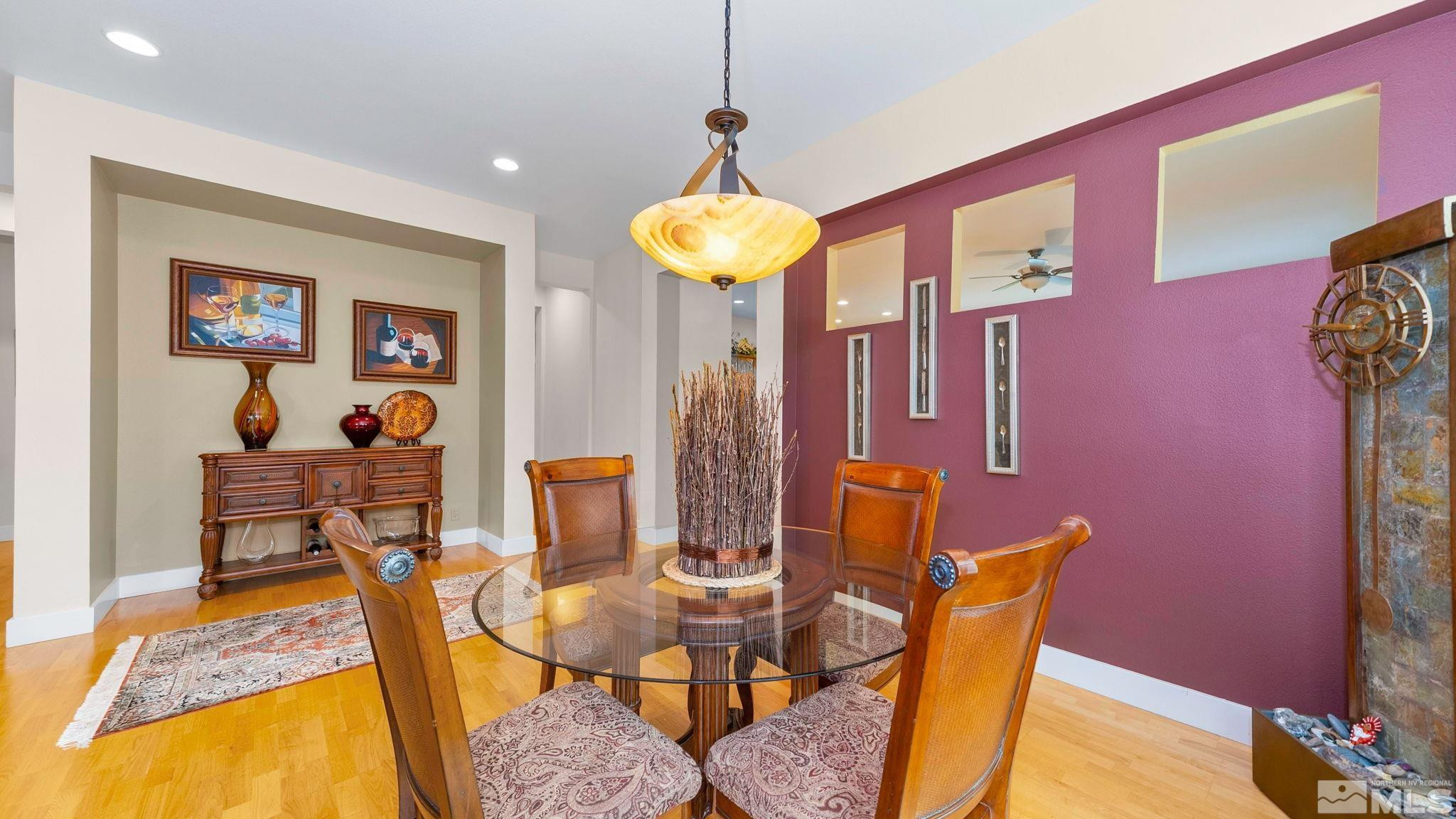 4940 Turning Leaf Way Reno, NV 89519 - Photo 12 of 34 a dining room with furniture and wooden floor