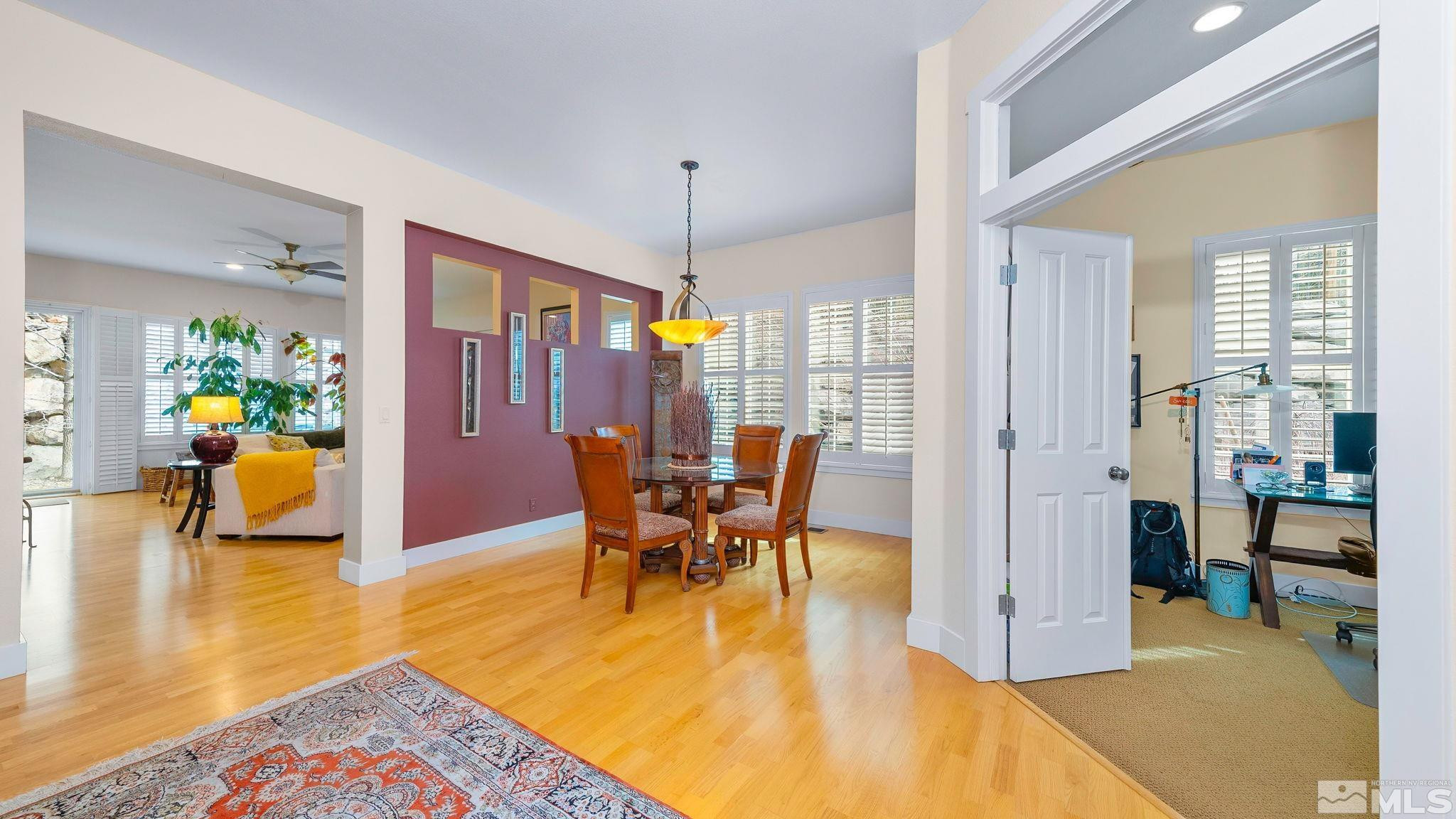 4940 Turning Leaf Way Reno, NV 89519 - Photo 14 of 34 a view of a dining room with furniture and chandelier