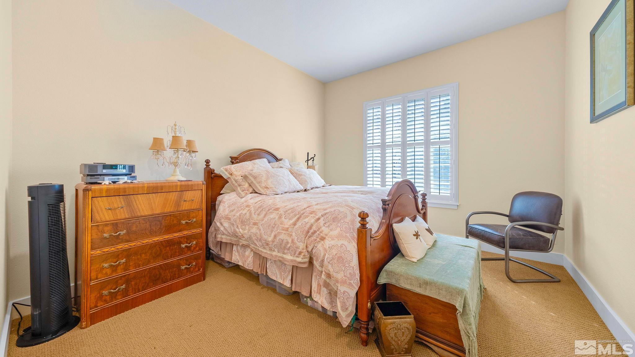 4940 Turning Leaf Way Reno, NV 89519 - Photo 24 of 34 a bedroom with a bed and a cabinets