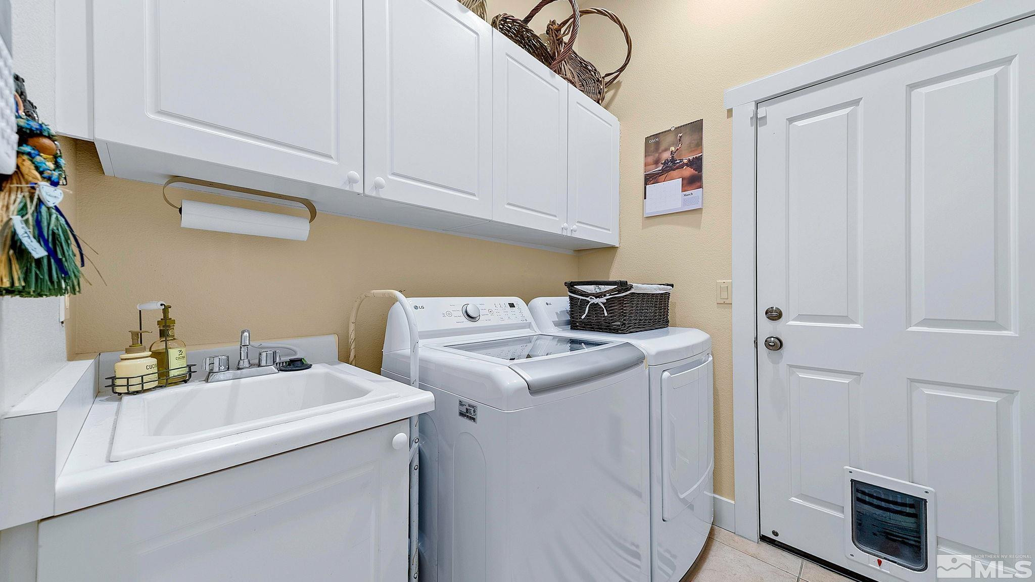 4940 Turning Leaf Way Reno, NV 89519 - Photo 26 of 34 a utility room with dryer and washer