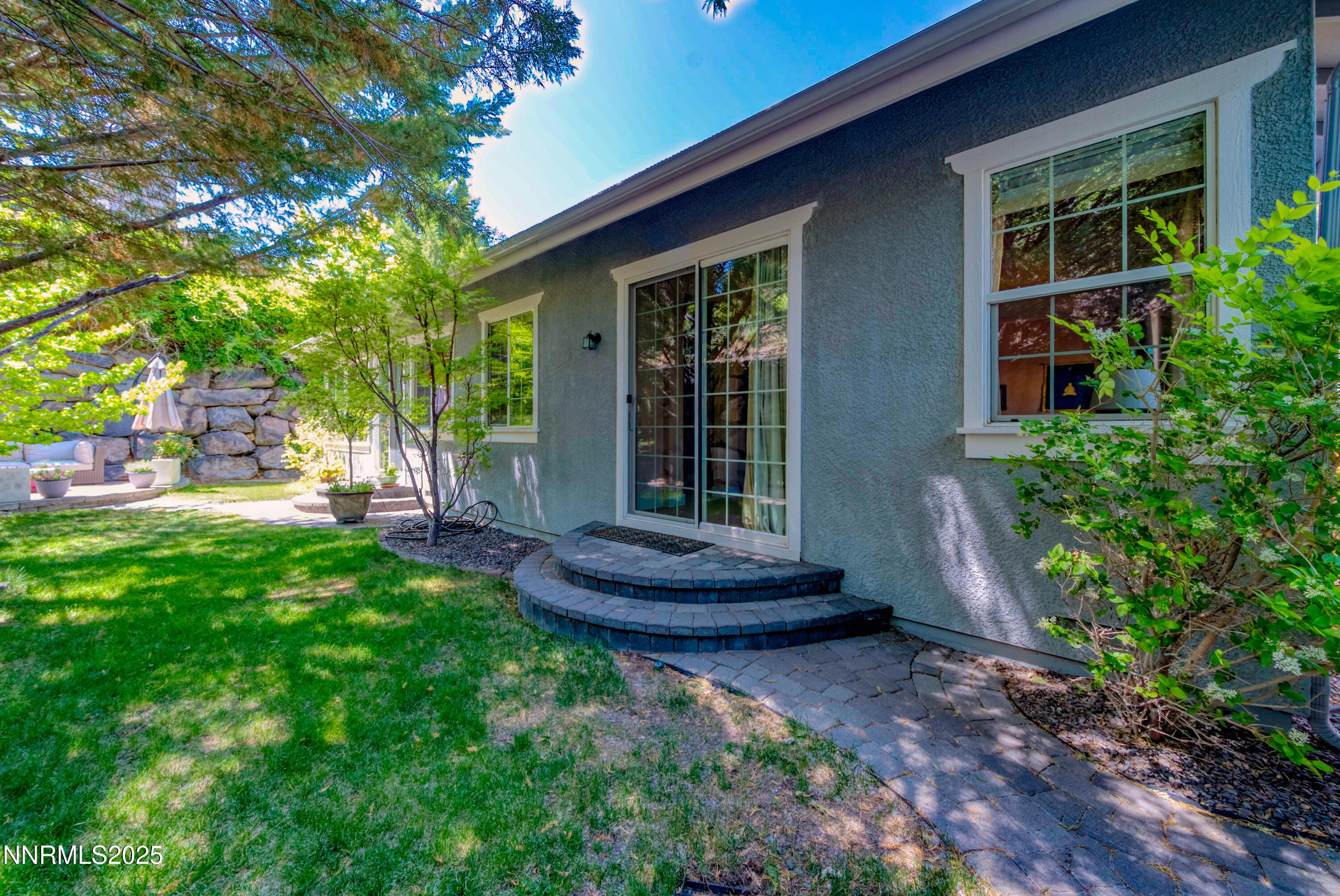 4940 Turning Leaf Way Reno, NV 89519 - Photo 30 of 34 a view of a house with backyard and garden