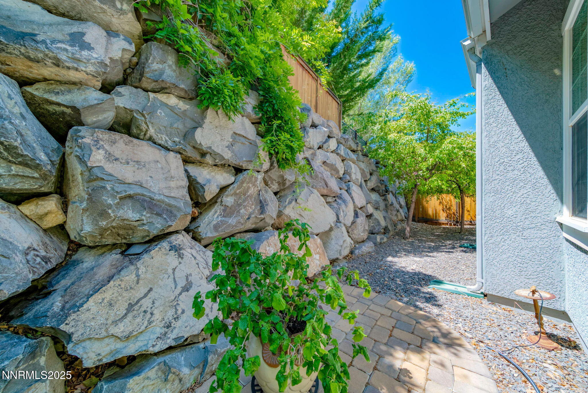 4940 Turning Leaf Way Reno, NV 89519 - Photo 33 of 34 a backyard of a house with lots of green space