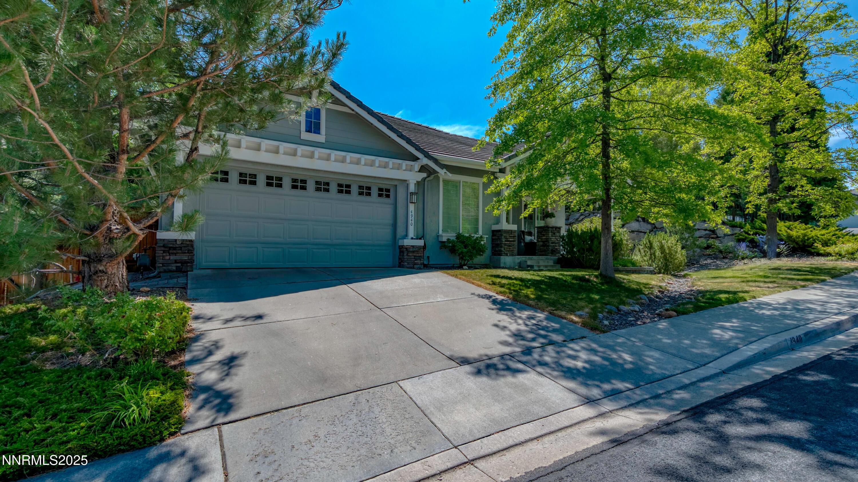 4940 Turning Leaf Way Reno, NV 89519 - Photo 34 of 34 a front view of a house with a yard