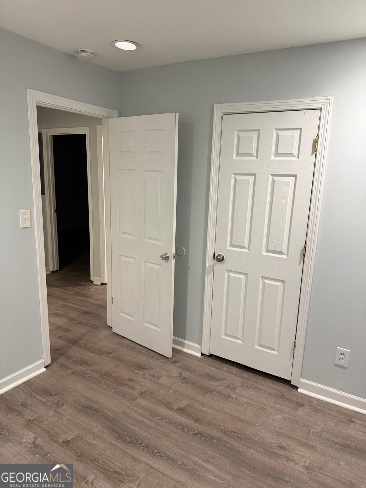 3456 Thompson Drive Northwest Atlanta, GA 30331 - Photo 13 of 18 an empty room with wooden floor and closet area