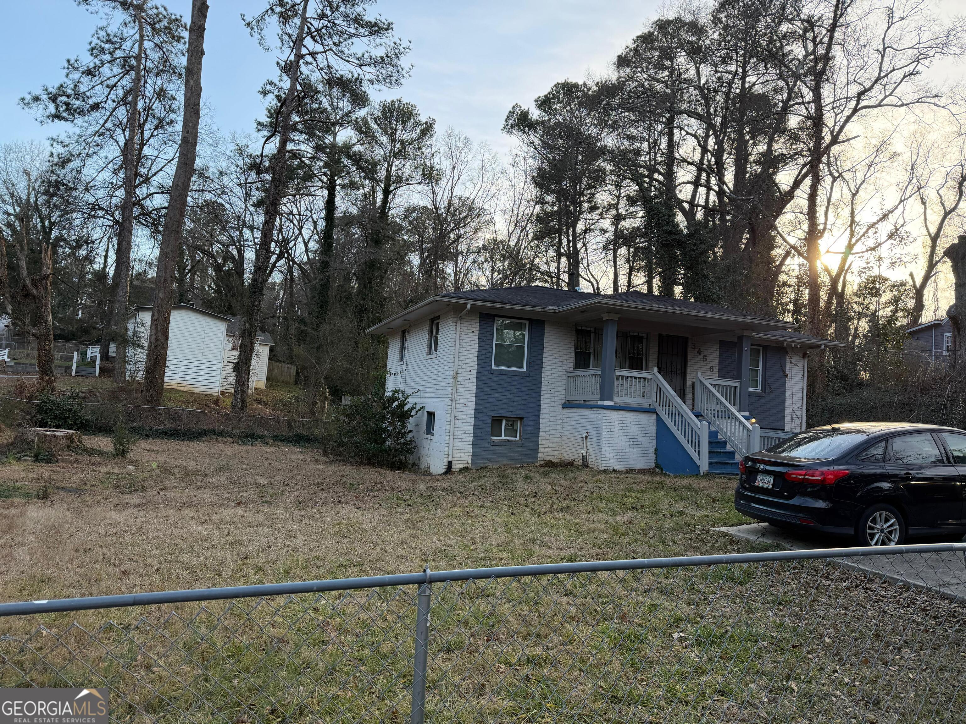 3456 Thompson Drive Northwest Atlanta, GA 30331 - Photo 17 of 18 a front view of a house with cars parked
