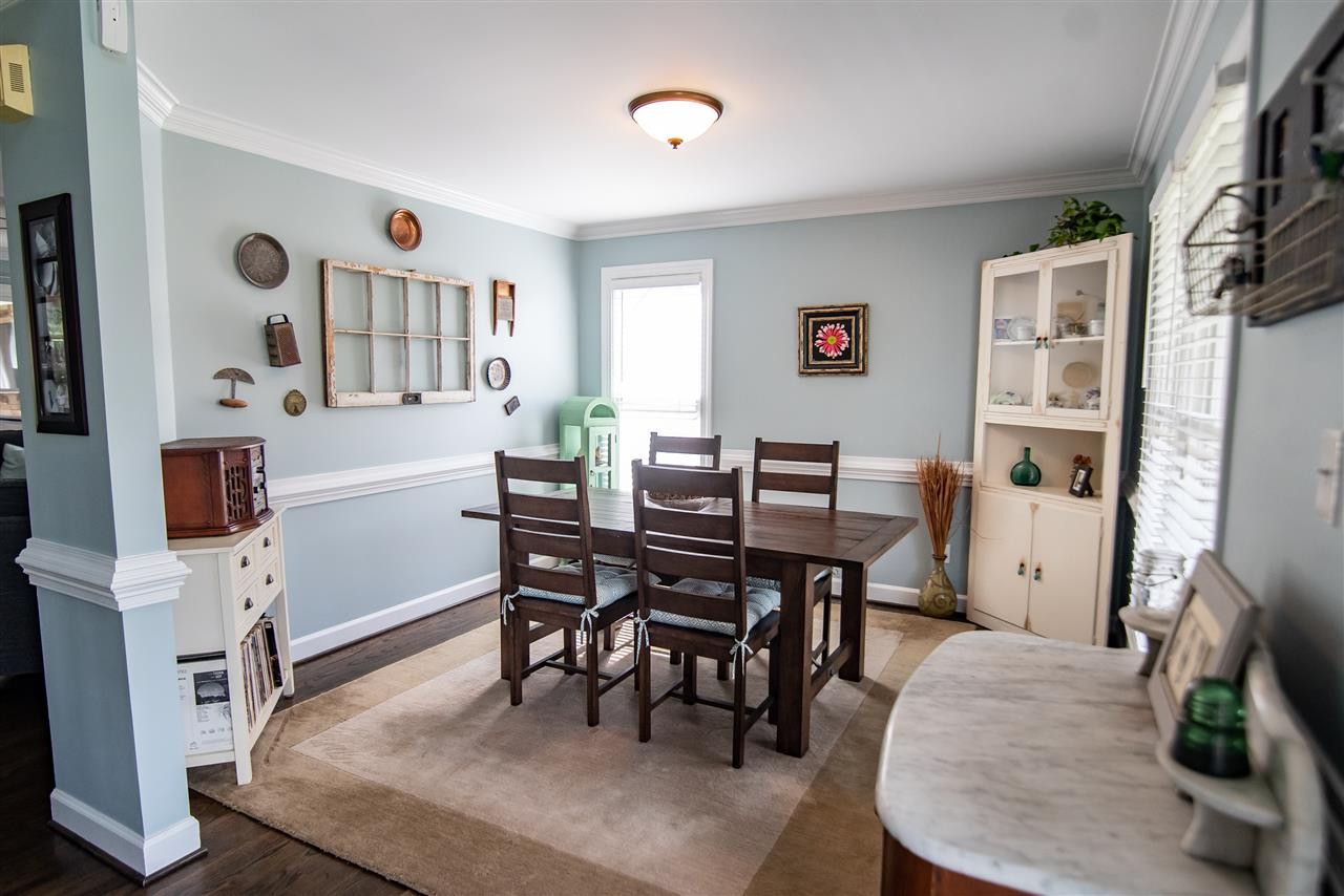 9116 Dawnshire Road Raleigh, NC 27615 - Photo 5 of 30 Your guests will love dining in this delightful space. Crown molding and bold trim adds to its charm! Dining Room