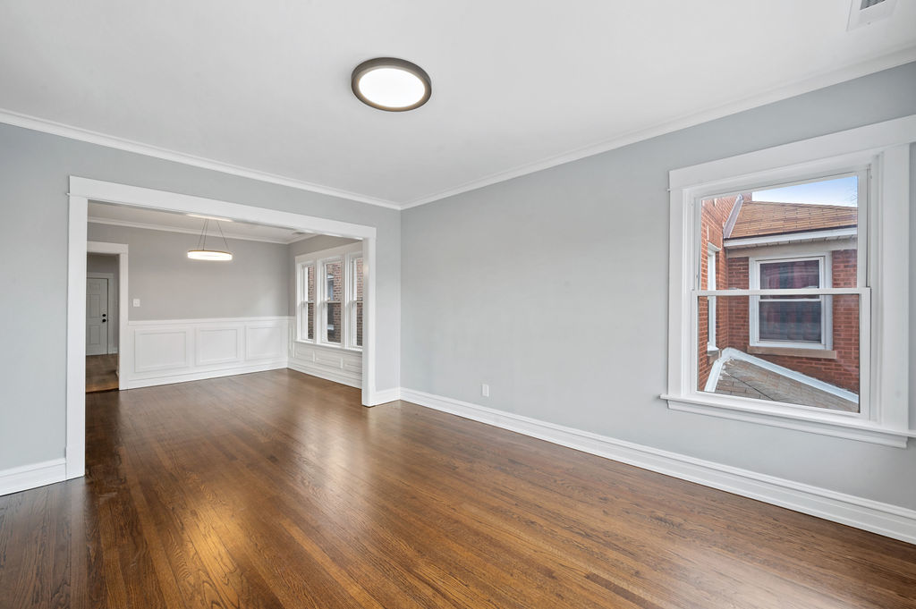 5230 West Deming Place Chicago, IL 60639 - Photo 25 of 45 a view of an empty room with wooden floor and windows