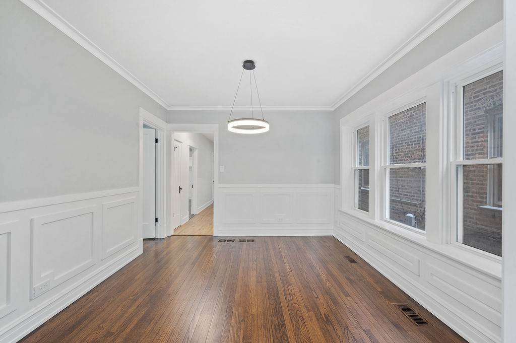 5230 West Deming Place Chicago, IL 60639 - Photo 27 of 45 a view of a room with wooden floors and window