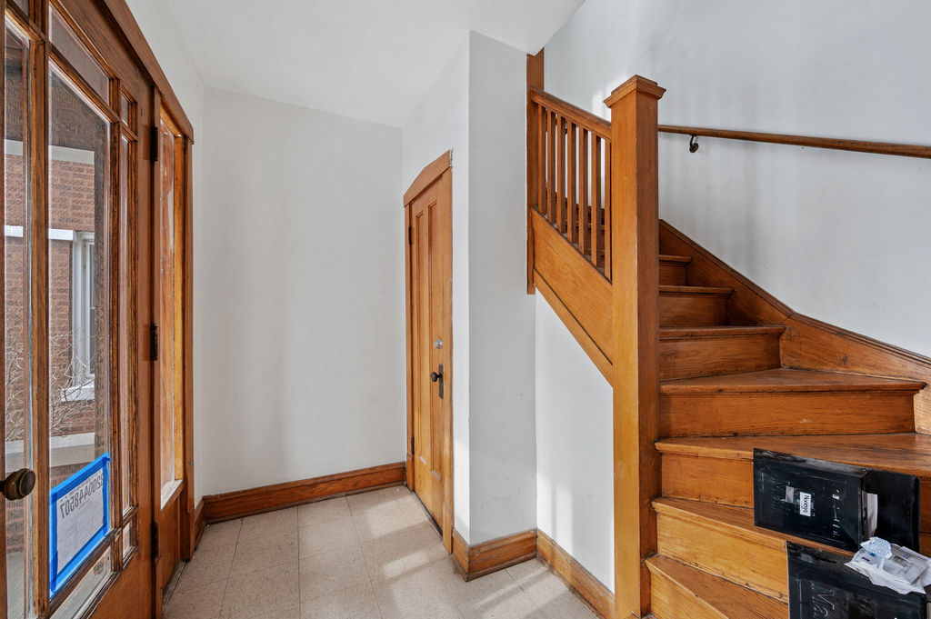 5230 West Deming Place Chicago, IL 60639 - Photo 6 of 45 a view of a hallway with staircase