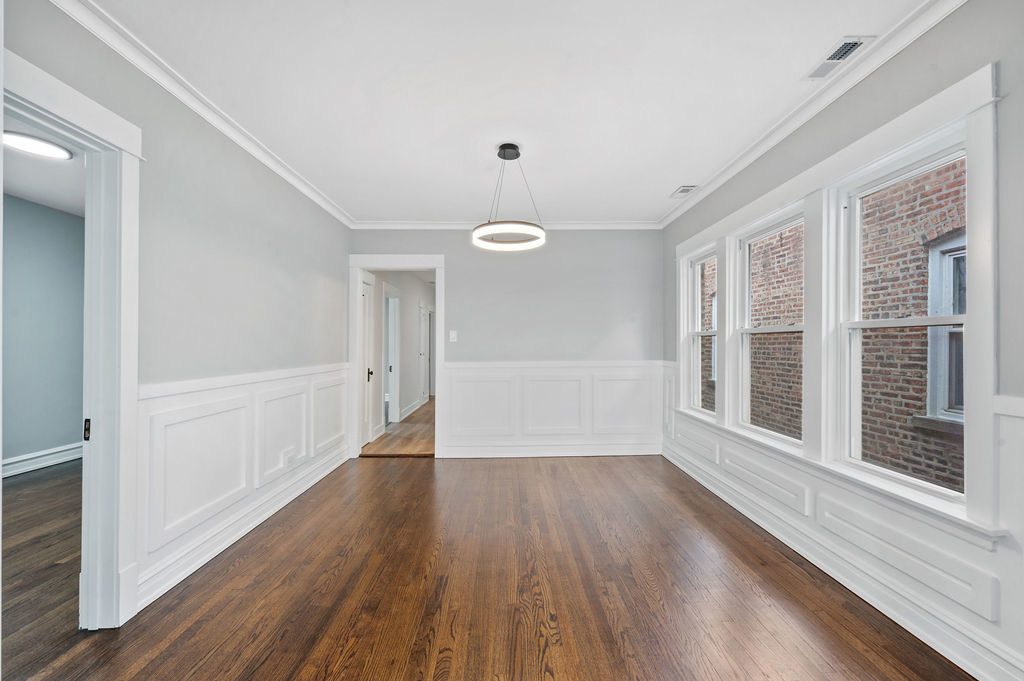 5230 West Deming Place Chicago, IL 60639 - Photo 9 of 45 wooden floor in an empty room with a window