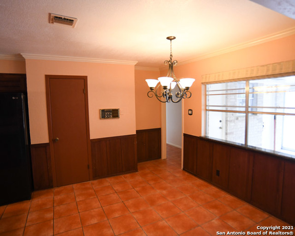 6207 Shady Brook Windcrest, TX 78239 - Photo 12 of 23 a bedroom with a bed dresser and a window