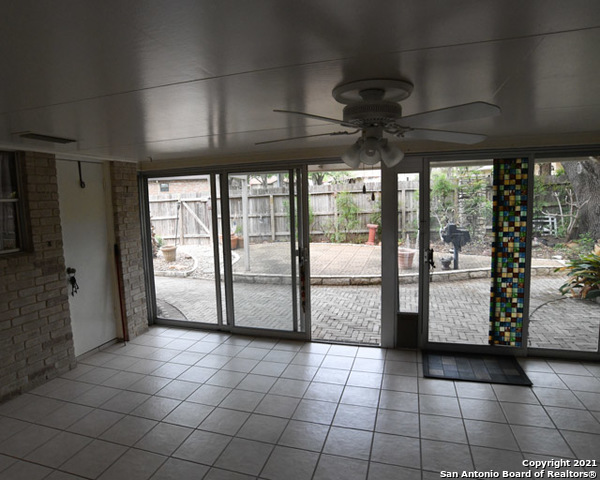 6207 Shady Brook Windcrest, TX 78239 - Photo 2 of 23 a view of a livingroom with a chandelier and fireplace