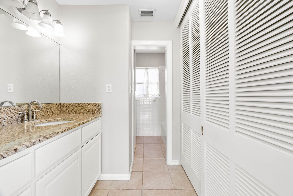 1931 North Fulton Beach Road Rockport, TX 78382 - Photo 19 of 40 a bathroom with a sink and a mirror