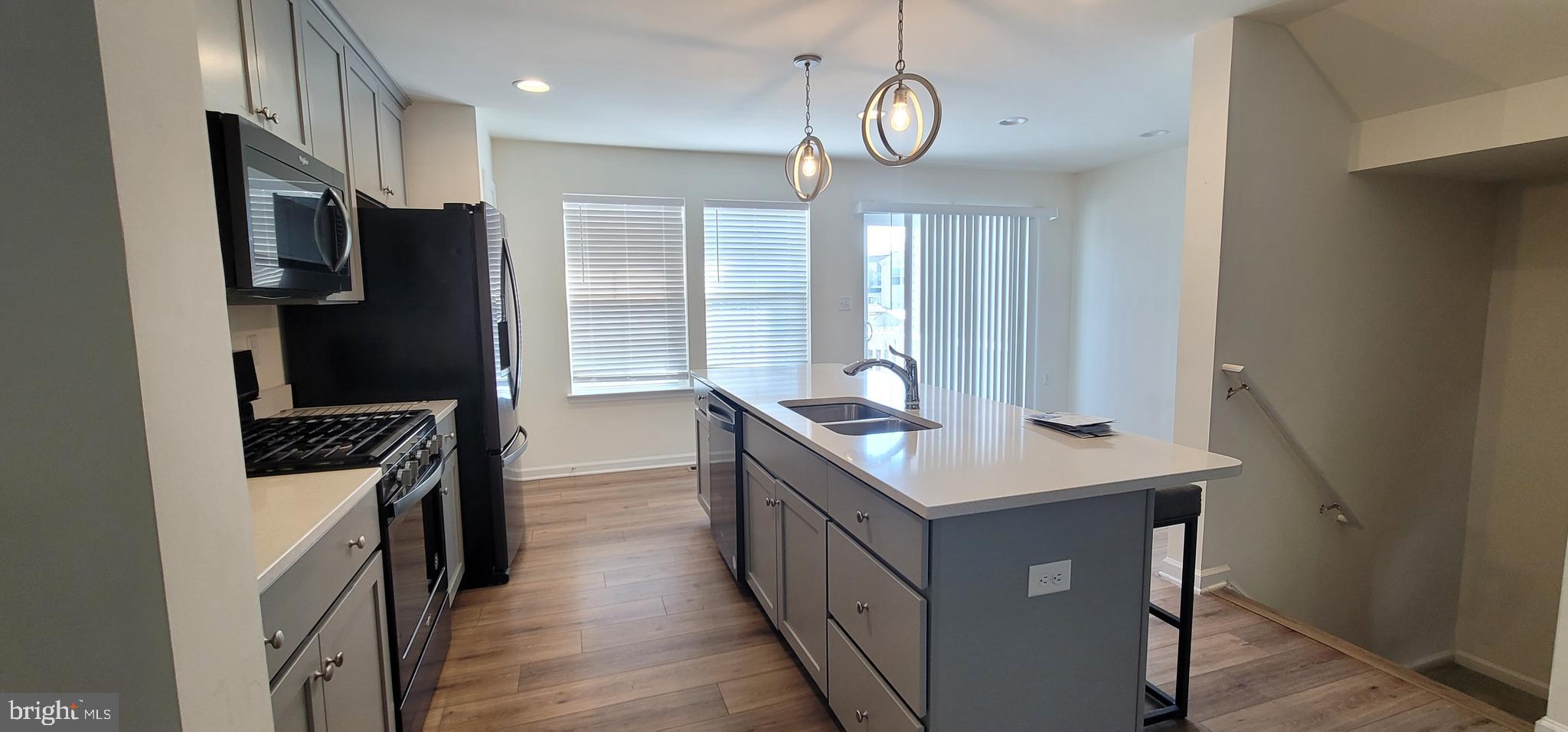 76 Capshaw Road Martinsburg, WV 25403 - Photo 4 of 12 a kitchen with stainless steel appliances granite countertop a refrigerator a stove and a sink