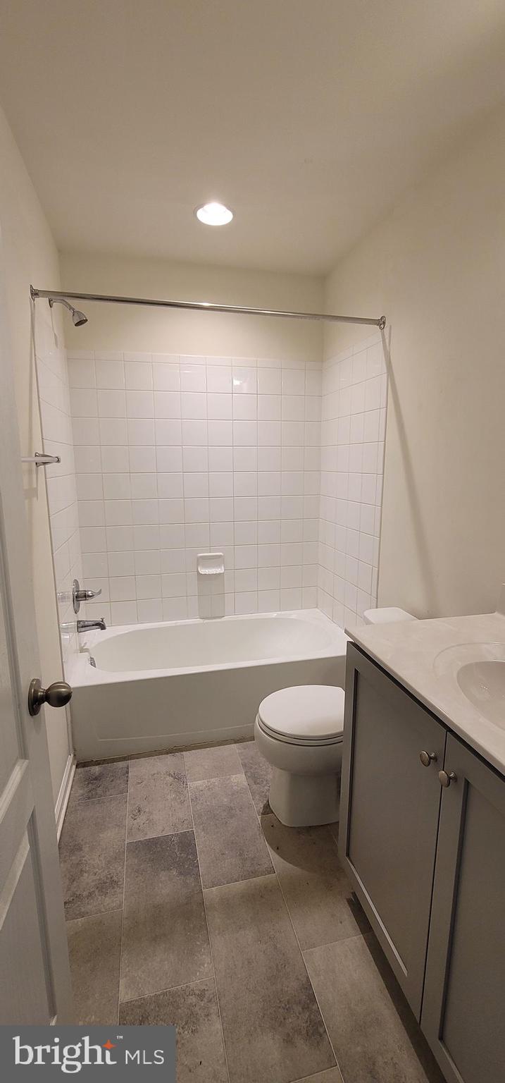 76 Capshaw Road Martinsburg, WV 25403 - Photo 8 of 12 a bathroom with a toilet a sink and bathtub