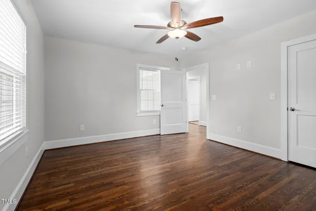 a kitchen with stainless steel appliances granite countertop a sink dishwasher a stove and a microwave oven with cabinets