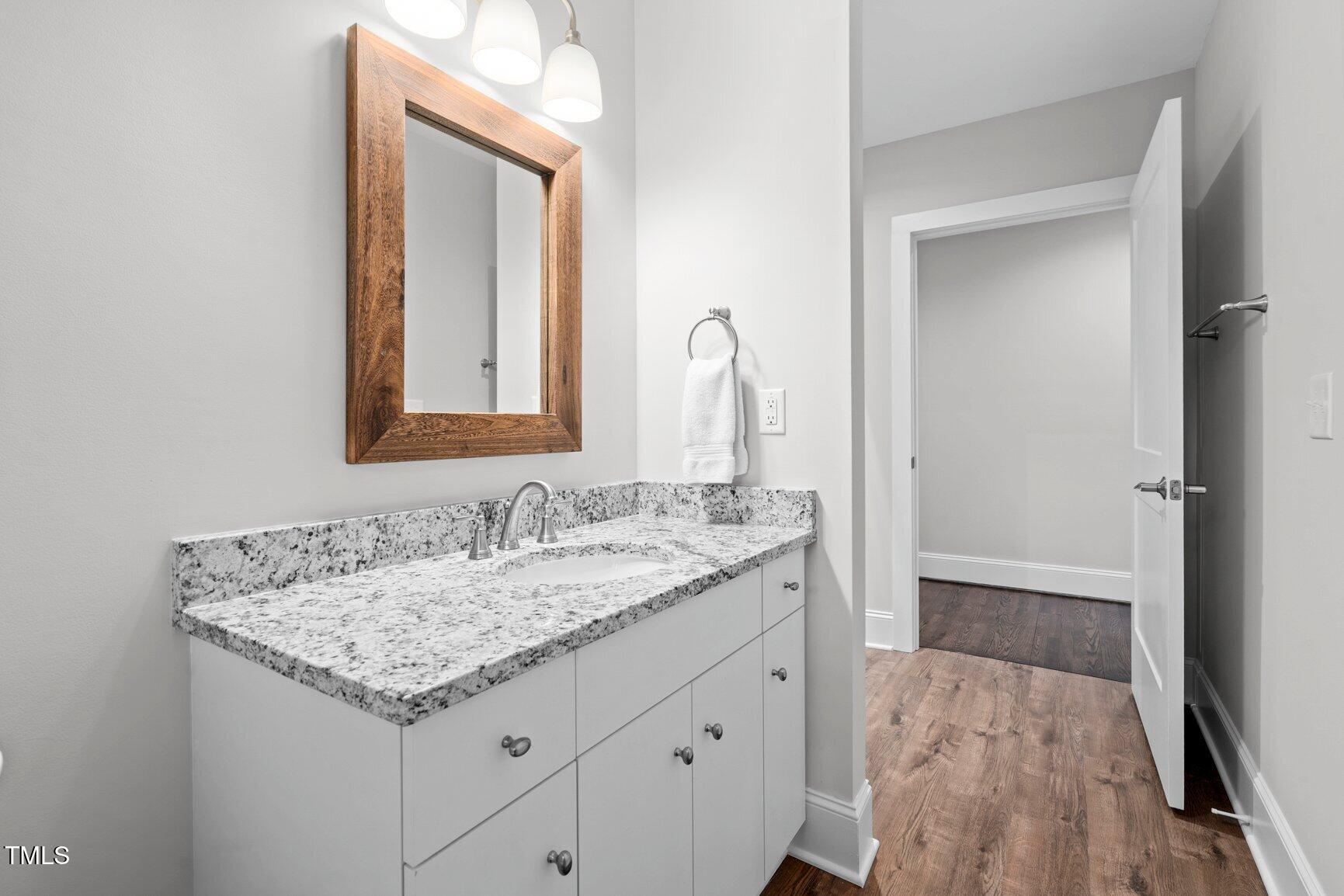 419 West Burnette Avenue Enfield, NC 27823 - Photo 14 of 23 a bathroom with a sink and a mirror