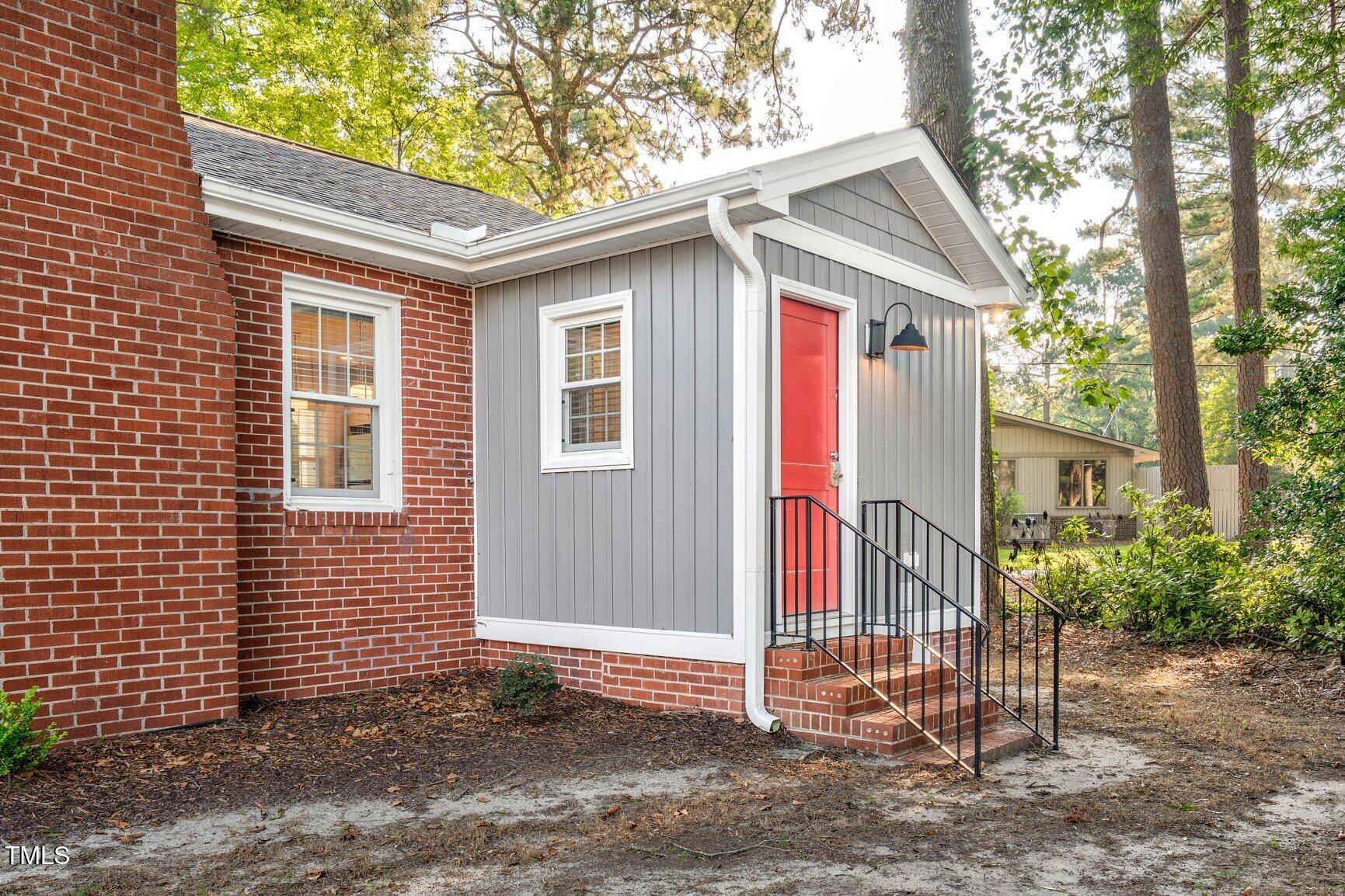 419 West Burnette Avenue Enfield, NC 27823 - Photo 20 of 23 a front view of a house with a porch