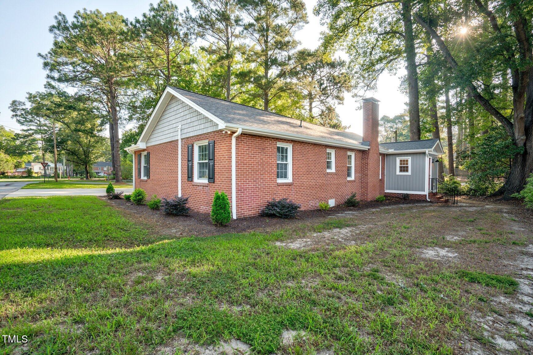 419 West Burnette Avenue Enfield, NC 27823 - Photo 21 of 23 a view of backyard of house with green space