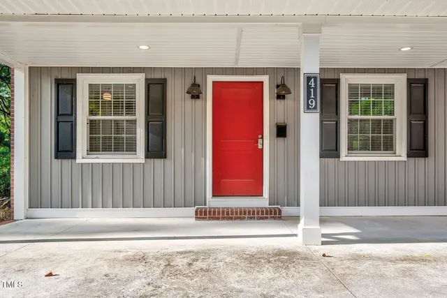 a front view of house with yard outdoor seating and green space