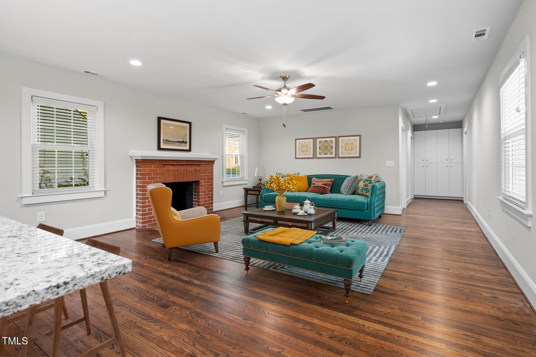 419 West Burnette Avenue Enfield, NC 27823 - Photo 4 of 23 a living room with furniture and a fireplace